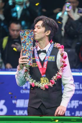 SHANGRAO, CHINA - MARCH 22: Thepchaiya Un-Nooh of Thailand kisses his champion trophy after winning the Final match against Ronnie O Sullivan of England on day 7 of the World Open Snooker 2026 at the Yushan Sports Center on March 22, 2026 in Shangrao, Jiangxi Province of China.  Copyright: xChinaxNewsxServicex 111630158528