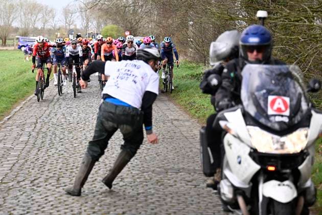 Tour of Bruges 2026 Cycling Race BRUGGE, BELGIUM - MARCH 25 : a supporter on the road in front of the peloton during the 50th edition of Tour of Bruges an UCI World Tour 1.UWT one day cycling road race for Men Elite of 202.9 km with start in Brugge and finish in Brugge on March 25, 2026 in Brugge, Belgium, 25 03 2026 ( Motordriver Kenny Verfaillie - Brugge Belgium  Copyright: xTomasxSiskx