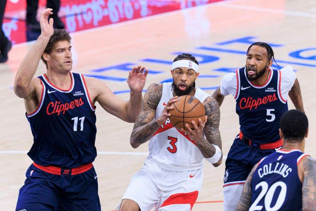 March 25, 2026, Inglewood, California, USA: Brandon Ingram 3 of the Toronto Raptors drives as Brook Lopez 11, Derrick Jones Jr. 5 and John Collins 20 of the Los Angeles Clippers defend during regular season NBA, Basketball Herren, USA game on Wednesday March 25, 2026 at Intuit Dome in Inglewood, California. ARIANA RUIZ PI Clippers Vs. Raptors  - ZUMAp124 20260325_zaa_p124_021 Copyright: xArianaxRuizx
