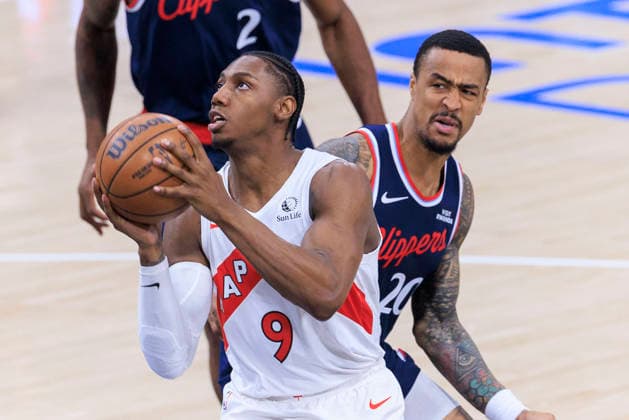 March 25, 2026, Inglewood, California, USA: RJ Barrett 9 of the Toronto Raptors drives past John Collins 20 of the Los Angeles Clippers during regular season NBA, Basketball Herren, USA game on Wednesday March 25, 2026 at Intuit Dome in Inglewood, California. ARIANA RUIZ PI Inglewood USA - ZUMAp124 20260325_zaa_p124_017 Copyright: xArianaxRuizx