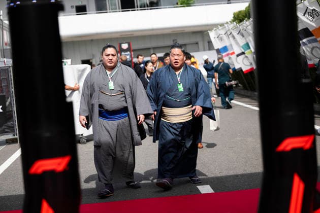 March 26, 2026, Suzuka, Mie, Japan: Sumo wrestlers visiting the paddock on media day for the 2026 Formula 1 Japanese Grand Prix. Formula 1 is one of the most logistically complicated sporting events in the world and the price of motorsport logistics has been affected by the US-Iran warÃ¢â‚¬â ¢s impact on air freight shipping lanes and oil prices. Suzuka Japan - ZUMAb177 20260326_aap_b177_053 Copyright: xTaidghxBarronx