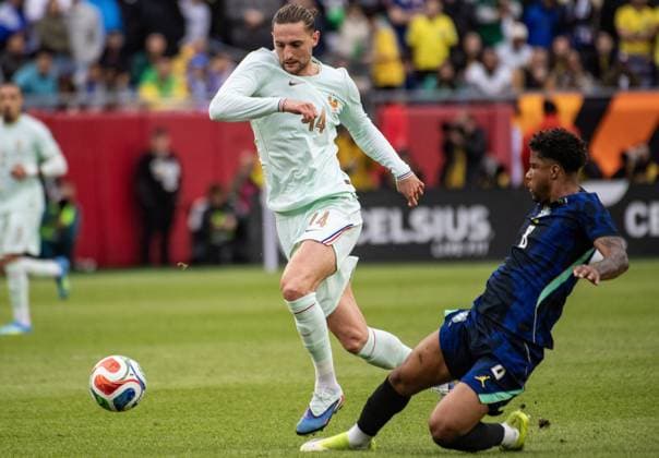 Brazil v France - International Friendly, Länderspiel, Nationalmannschaft FOXBOROUGH, UNITED STATES - MARCH 26: France’s Adrien Rabiot (14) evades a sliding tackle from Brazil’s Andrey Santos (8) during an international pre-World Cup friendly match between Brazil and France as part of the Road to 26 game series at Gillette Stadium in Foxborough, United States, on March 26, 2026. Joseph Prezioso Anadolu Foxborough United States. Editorial use only. Please get in touch for any other usage.  Copyright: x2026xAnadoluxJosephxPreziosox