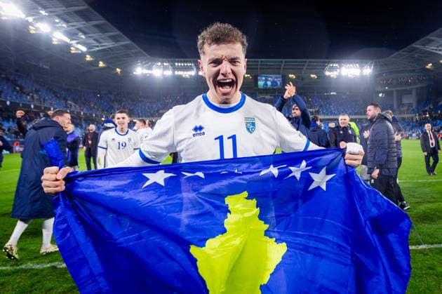 SLOVAKIA - KOSOVO Fisnik Asllani of Kosovo and TSG Hoffenheim celebrates advance with a flag after the knockout (KO) play off of FIFA World Cup, WM, Weltmeisterschaft, Fussball 2026 WM, Weltmeisterschaft, Fussball WM, Weltmeisterschaft, Fussball qualification football match between Slovakia and Kosovo. Narodny futbalovy stadion, National football stadium, Tehelne Pole, Bratislava, Slovakia, March 26, 2026. Photo by Branislav Racko Copyright: xx _BRR3736
