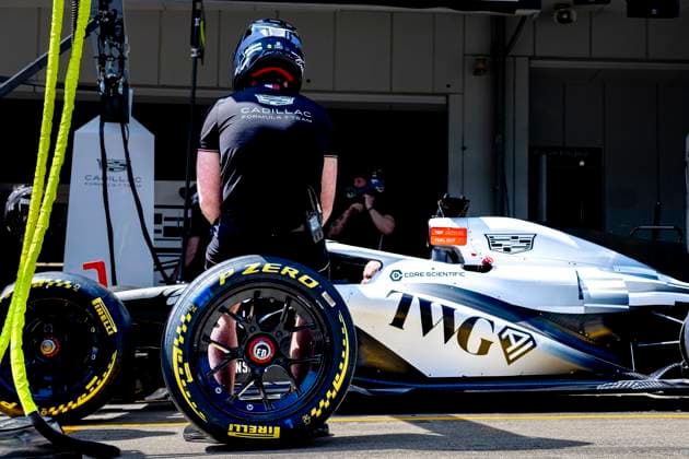 SUZUKA - Mechanic sits on a wheel next to the car of Formula 1 driver Sergio Pï¿½rez or Cadillac Formula 1 Team during the Formula 1 Japan Suzuka free practice at the Suzuka Formula 1 circuit on March 27, 2025 in Suzuka, Japan. (Photo by DeFodi Images) -