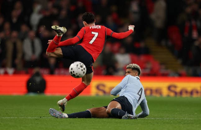 Phil Foden of England with Ronald Araujo of Uruguay England v Uruguay. Football. Wembley Stadium, London, UK. 27 MAR 2026Wembley Wembley Stadium LONDON United Kingdom  Copyright: xJASONPIX Shutterstockx 16805560dz