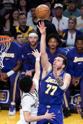 March 27, 2026, Los Angeles, California, USA: Los Angeles LakersÃ¢â‚¬â ¢ Luka DonÄÂiÄ¡ (77) shoots against Brooklyn NetsÃ¢â‚¬â ¢ Nolan Traore (88) during an NBA, Basketball Herren, USA basketball game at Crypto.com Arena on Friday, March 27, 2026 in Los Angeles. NBA 2026: Nets Vs Lakers  - ZUMAc68_ 20260327_zaf_c68_003 Copyright: xRingoxChiux