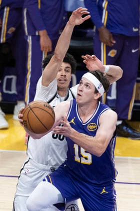 March 27, 2026, Los Angeles, California, USA: Los Angeles LakersÃ¢â‚¬â ¢ Austin Reaves (15) goes to the basket under pressure from Brooklyn NetsÃ¢â‚¬â ¢ Nolan Traore (88) during an NBA, Basketball Herren, USA basketball game at Crypto.com Arena on Friday, March 27, 2026 in Los Angeles. NBA 2026: Nets Vs Lakers  - ZUMAc68_ 20260327_zaf_c68_005 Copyright: xRingoxChiux