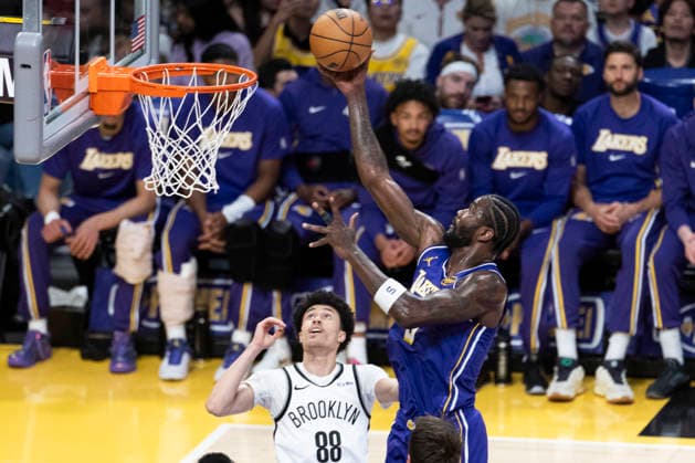 March 27, 2026, Los Angeles, California, USA: Los Angeles LakersÃ¢â‚¬â ¢ Deandre Ayton (5) goes to the basket against Brooklyn NetsÃ¢â‚¬â ¢ Nolan Traore (88) during an NBA, Basketball Herren, USA basketball game at Crypto.com Arena on Friday, March 27, 2026 in Los Angeles. NBA 2026: Nets Vs Lakers  - ZUMAc68_ 20260327_zaf_c68_011 Copyright: xRingoxChiux