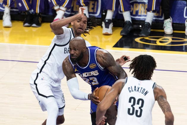 March 27, 2026, Los Angeles, California, USA: Los Angeles LakersÃ¢â‚¬â ¢ LeBron James (23) drives between Brooklyn NetsÃ¢â‚¬â ¢ Ziaire Williams (1) and Brooklyn NetsÃ¢â‚¬â ¢ Nic Claxton (33) during an NBA, Basketball Herren, USA basketball game at Crypto.com Arena on Friday, March 27, 2026 in Los Angeles. NBA 2026: Nets Vs Lakers  - ZUMAc68_ 20260327_zaf_c68_019 Copyright: xRingoxChiux