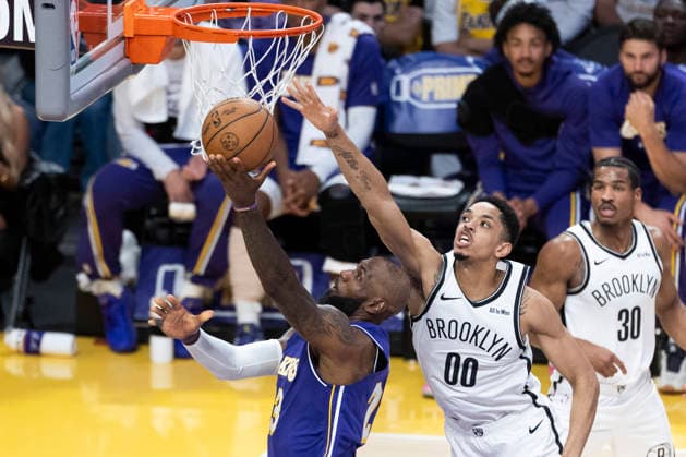 March 27, 2026, Los Angeles, California, USA: Los Angeles LakersÃ¢â‚¬â ¢ LeBron James (23) goes to the basket under pressure from Brooklyn NetsÃ¢â‚¬â ¢ Josh Minott (00) during an NBA, Basketball Herren, USA basketball game at Crypto.com Arena on Friday, March 27, 2026 in Los Angeles. NBA 2026: Nets Vs Lakers  - ZUMAc68_ 20260327_zaf_c68_032 Copyright: xRingoxChiux