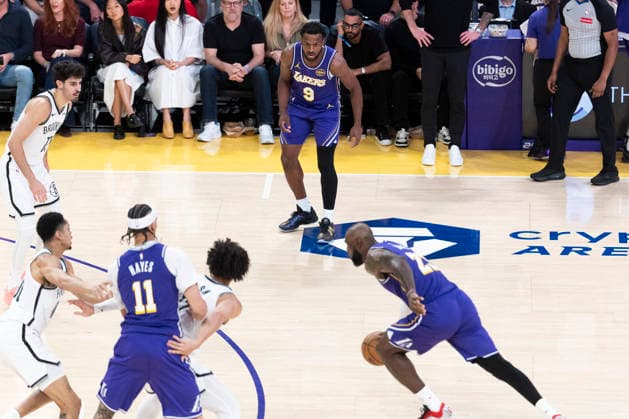 March 27, 2026, Los Angeles, California, USA: Los Angeles LakersÃ¢â‚¬â ¢ Bronny James (9) watches as LeBron James (23) drives against the Brooklyn Nets during an NBA, Basketball Herren, USA basketball game at Crypto.com Arena on Friday, March 27, 2026 in Los Angeles. NBA 2026: Nets Vs Lakers  - ZUMAc68_ 20260327_zaf_c68_035 Copyright: xRingoxChiux