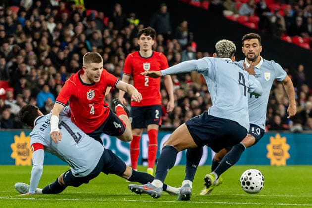 England v Uruguay, Friendly England midfielder Adam Wharton tackled in box during the Friendly match between England and Uruguay at Wembley Stadium, London, UK on 27 March 2026. London Wembley Stadium Greater London UK Editorial use only , Copyright: xManjitxNarotrax PSI-23956-0096