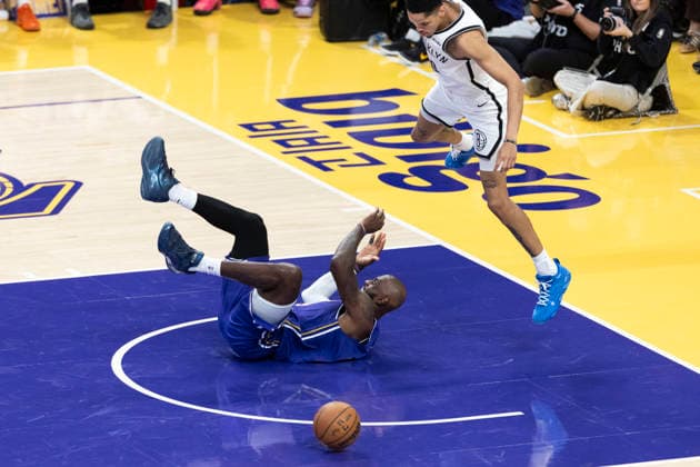 March 27, 2026, Los Angeles, California, USA: Los Angeles LakersÃ¢â‚¬â ¢ LeBron James (23) falls after colliding with Brooklyn NetsÃ¢â‚¬â ¢ Josh Minott (00) during an NBA, Basketball Herren, USA basketball game at Crypto.com Arena on Friday, March 27, 2026 in Los Angeles. NBA 2026: Lakers 116:99 Nets  - ZUMAc68_ 20260327_zaf_c68_052 Copyright: xRingoxChiux