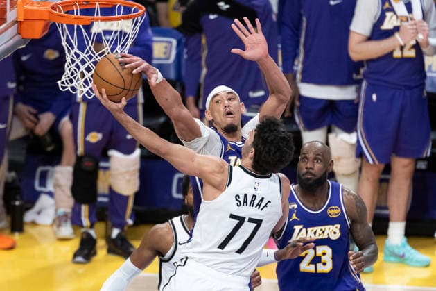 March 27, 2026, Los Angeles, California, USA: Brooklyn NetsÃ¢â‚¬â ¢ Ben Saraf (77) goes to the basket under pressure from Los Angeles LakersÃ¢â‚¬â ¢ Jaxson Hayes (11) during an NBA, Basketball Herren, USA basketball game at Crypto.com Arena on Friday, March 27, 2026 in Los Angeles. NBA 2026: Lakers 116:99 Nets  - ZUMAc68_ 20260327_zaf_c68_061 Copyright: xRingoxChiux