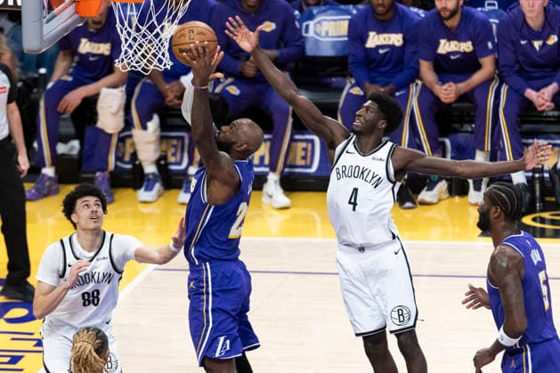 March 27, 2026, Los Angeles, California, United States: Los Angeles Lakers™ LeBron James (23) goes to the basket under pressure from Brooklyn Nets™ Drake Powell (4) during an NBA, Basketball Herren, USA basketball game at Crypto.com Arena on Friday, March 27, 2026 in Los Angeles. NBA 2026: Lakers 116:99 Nets - 27 Mar 2026  - ZUMAs197 20260327_aaa_s197_547 Copyright: xRingoxChiux