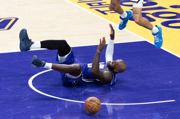 March 27, 2026, Los Angeles, California, United States: Los Angeles Lakers™ LeBron James (23) falls after colliding with Brooklyn Nets™ Josh Minott (00) during an NBA, Basketball Herren, USA basketball game at Crypto.com Arena on Friday, March 27, 2026 in Los Angeles. NBA 2026: Lakers 116:99 Nets - 27 Mar 2026  - ZUMAs197 20260327_aaa_s197_550 Copyright: xRingoxChiux