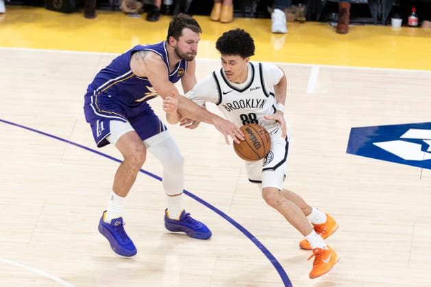 March 27, 2026, Los Angeles, California, United States: Brooklyn Nets™ Nolan Traore (88) drives against Los Angeles Lakers™ Luka Don?i? (77) during an NBA, Basketball Herren, USA basketball game at Crypto.com Arena on Friday, March 27, 2026 in Los Angeles. NBA 2026: Lakers 116:99 Nets - 27 Mar 2026  - ZUMAs197 20260327_aaa_s197_555 Copyright: xRingoxChiux
