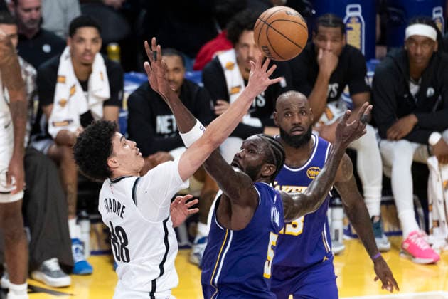 March 27, 2026, Los Angeles, California, United States: Brooklyn Nets™ Nolan Traore (88) shoots under pressure from Los Angeles Lakers™ Deandre Ayton (5) during an NBA, Basketball Herren, USA basketball game at Crypto.com Arena on Friday, March 27, 2026 in Los Angeles. NBA 2026: Lakers 116:99 Nets - 27 Mar 2026  - ZUMAs197 20260327_aaa_s197_560 Copyright: xRingoxChiux