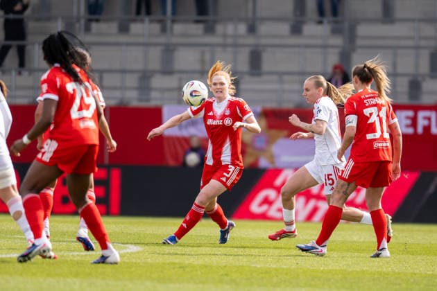 Stine Ballisager Pedersen 3 (FC Bayern Muenchen) im Zweikampf mit Emoeke Papai 15 (1. FC Nuernberg), FC Bayern Frauen Muenchen - 1. FC Nuernberg, Google Pixel Frauenbundesliga, 22. Spieltag, 28.03.26 DFB regulations prohibit any use of photographs as image sequences and or quasi-video. (kolbert-press) Muenchen Bayern Deutschland