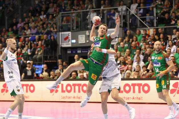 28.03.2026, xtgx, Handball, Daikin HBL, SC Magdeburg - Füchse Berlin v.l. Felix Claar (Magdeburg, 7) wirft Tor, Torschuetze, erzielt Tor, Treffer, scores the goal Magdeburg