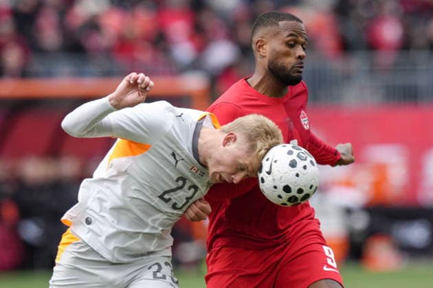 March 28, 2026, Toronto, On, CANADA: Iceland defender Hordor Bjorgvin Magnusson clears the ball away from Canadian striker Cyle Larin in Toronto on Saturday, March 28, 2026. Hordor Bjorgvin Magnusson; Cyle Larin  - ZUMAc35_ 20260328_zaf_c35_024 Copyright: xChrisxYoungx