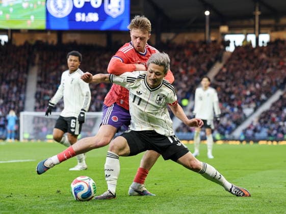 Soccer International Friendly, Länderspiel, Nationalmannschaft - Scotland vs Japan Tommy Conway (L) of Scotland and Daizen Maeda of Japan in action during the international friendly soccer match between Scotland and Japan in Glasgow, Britain, 28 March 2026. Glasgow United Kingdom  Copyright: xROBERTxPERRYx