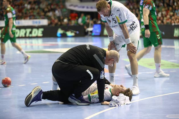 28.03.2026, xtgx, Handball, Daikin HBL, SC Magdeburg - Füchse Berlin v.l. Nils Lichtlein (Berlin, 17) verletzt Verltzung Magdeburg