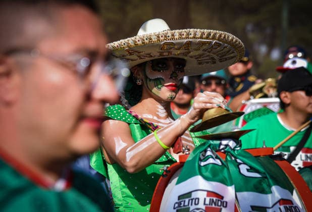 Fans Gather Ahead Of Mexico Vs Portugal At The Reopening Of Estadio Banorte A Mexico national team, Nationalteam supporter wearing Catrina face paint and a traditional hat plays music with a barra brava outside Estadio Banorte in Mexico City, Mexico, on March 28, 2026, ahead of the International Friendly, Länderspiel, Nationalmannschaft match between Mexico and Portugal. Catrina makeup is a cultural symbol associated with Mexico s Day of the Dead and national identity. Mexico City Mexico  Copyright: xRafaelxRodriguezx originalFilename:rodriguez-notitle260328_np51i.jpg
