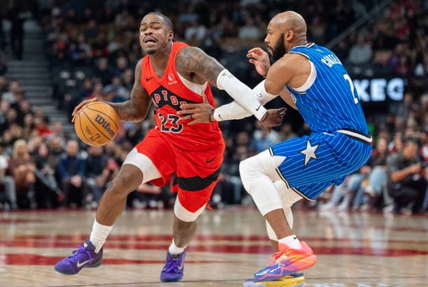March 29, 2026, Toronto, On, Canada: Toronto Raptors guard Jamal Shead (23) is fouled by Orlando Magic guard Jevon Carter (2) during first half NBA, Basketball Herren, USA action in Toronto on Sunday March 29, 2026. Canada News - March 29, 2026  - ZUMAc35_ 20260329_zaf_c35_185 Copyright: xFrankxGunnx