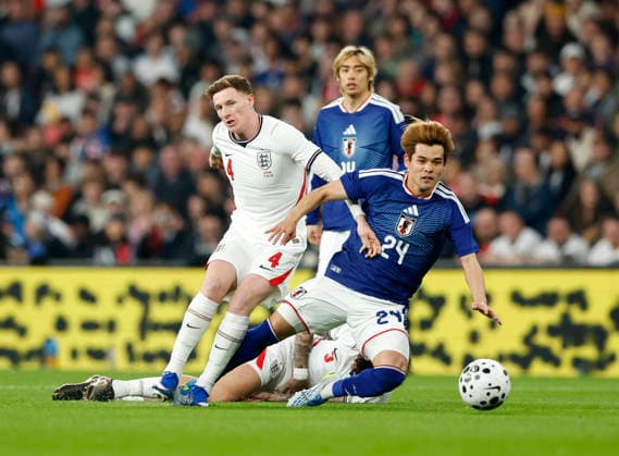 London, England, 31st March 2026. Elliot Anderson of England tussles with Kaishu Sano of Japan during the England vs Japan International Friendly, Länderspiel, Nationalmannschaft match at Wembley Stadium, London. Picture credit should read: Matthew Impey Sportimage EDITORIAL USE ONLY. No use with unauthorised audio, video, data, fixture lists, club league logos or live services. Online in-match use limited to 120 images, no video emulation. No use in betting, games or single club league player publications. SPI_029_MI_Eng_Japan SPI-4662-0028