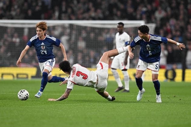 England v Japan, Friendly Nico O Reilly of England is fouled by Tsuyoshi Watanabe of Japan during the Friendly match between England and Japan at Wembley Stadium, London, UK on 31 March 2026. London Wembley Stadium Greater London UK Editorial use only , Copyright: xGrahamxHuntx PSI-23978-0052