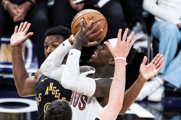 March 31, 2026, Los Angeles, California, USA: Cleveland CavaliersÃ¢â‚¬â ¢ Dennis Schroder (8) drives between Los Angeles LakersÃ¢â‚¬â ¢ Bronny James (9) and Jake LaRavia (12) during an NBA, Basketball Herren, USA basketball game at Crypto.com Arena on Tuesday, March 31, 2026 in Los Angeles. NBA 2026: Cavaliers Vs Lakers  - ZUMAc68_ 20260331_zaf_c68_018 Copyright: xRingoxChiux