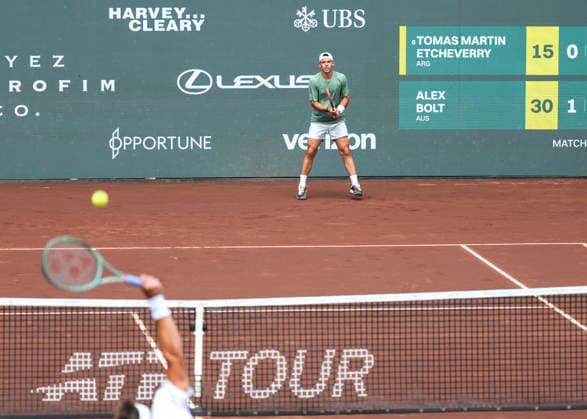 HOUSTON, TX - APRIL 01: Alex Bolt (AUS) watches the serve by Tomas Martin Etcheverry (ARG) during the singles round of 16 match at the Men™s Clay Court Championship on April 1, 2026 at River Oaks Country Club in Houston(Photo by Leslie Plaza Johnson Icon Sportswire) TENNIS: APR 01 US Men s Clay Court Championship EDITORIAL USE ONLY Icon260401012