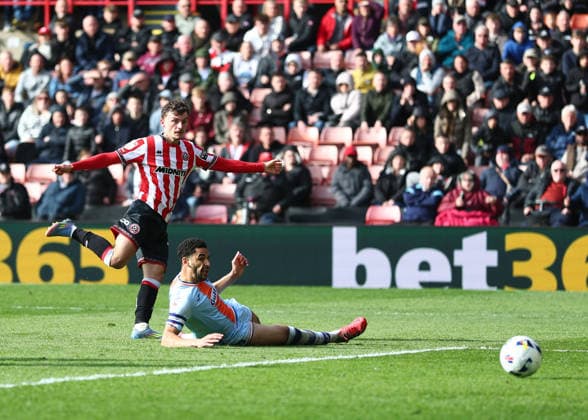 Sheffield, England, 3rd April 2026. Harrison Burrows of Sheffield United scores their second goal during the Sheffield United vs Swansea City Sky Bet Championship match at Bramall Lane, Sheffield. Picture credit should read: Simon Bellis Sportimage EDITORIAL USE ONLY. No use with unauthorised audio, video, data, fixture lists, club league logos or live services. Online in-match use limited to 120 images, no video emulation. No use in betting, games or single club league player publications. SPI_034_SB_Sheff_Utd_Swansea SPI-4660-0015