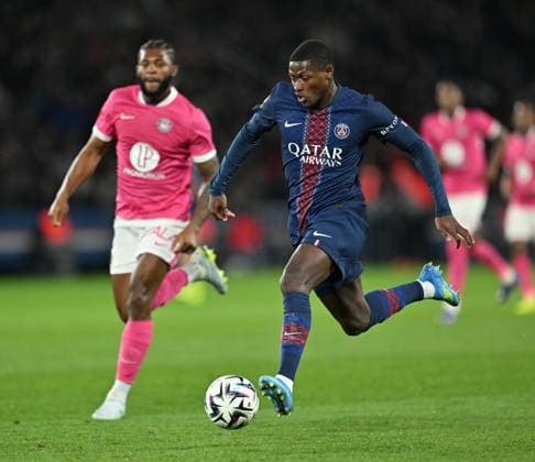 PSG vs Toulouse: French Ligue 1 PARIS, FRANCE - APRIL 03: Nuno Mendes (R) of Paris Saint - Germain in action during the French Ligue 1 (L1) soccer match between Paris Saint-Germain (PSG) and Toulouse FC at Parc des Princes stadium in Paris, France on April 03, 2026. Mustafa Yalcin Anadolu Paris France. Editorial use only. Please get in touch for any other usage.  Copyright: x2026xAnadoluxMustafaxYalcinx