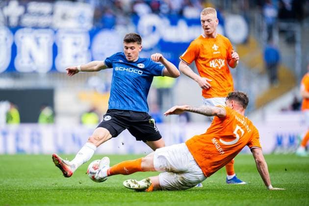 04.04.2026 - Fußball, 2025 2026, 2. Bundesliga, 28. Spieltag, DSC Arminia Bielefeld - SV Darmstadt 98: (L-R) Semir Telalovic (Bielefeld), Matej Maglica (Darmstadt) DFL REGULATIONS PROHIBIT ANY USE OF PHOTOGRAPHS AS IMAGE SEQUENCES AND OR QUASI-VIDEO.