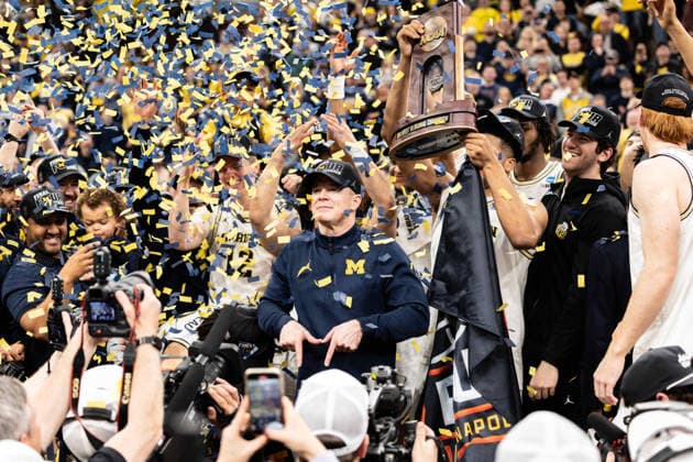 March 29, 2026, Chicago, Illinois, United States: Head coach Dusty May (C) of the Michigan Wolverines celebrates after a win against the Tennessee Volunteers in the Elite Eight round of the NCAA, College League, USA Men s Basketball Tournament at the United Center. Final score; Michigan 95-62 Tennessee. Chicago United States - ZUMAs197 20260329_aaa_s197_912 Copyright: xNicholasxMullerx