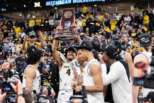 March 29, 2026, Chicago, Illinois, United States: Nimari Burnett (C) of the Michigan Wolverines celebrates after a win against the Tennessee Volunteers in the Elite Eight round of the NCAA, College League, USA Men s Basketball Tournament at the United Center. Final score; Michigan 95-62 Tennessee. Chicago United States - ZUMAs197 20260329_aaa_s197_917 Copyright: xNicholasxMullerx