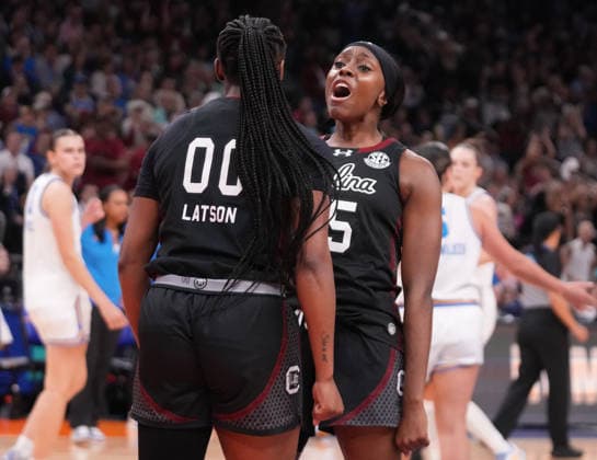 South Carolina guard Raven Johnson (25) celebrates with guard Ta niya Latson (00) against the UCLA Bruins in the first half of the Finals of the 2026 NCAA, College League, USA Women s Basketball Tournament at Mortgage Matchup Center in Phoenix, Arizona, on Sunday, April 5, 2026.  AZP20260405924 DARRYLxWEBB