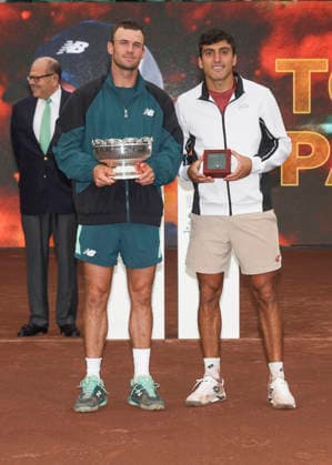 HOUSTON, TX - APRIL 05: (left to right) Tommy Paul (USA) holding the winner™s trophy stands next to finalist Roman Andres Burruchaga (ARG) during the singles finals of the Men™s Clay Court Championship on April 5, 2026 at River Oaks Country Club in Houston, Texas. (Photo by Leslie Plaza Johnson Icon Sportswire) TENNIS: APR 05 US Men s Clay Court Championship EDITORIAL USE ONLY Icon260405002