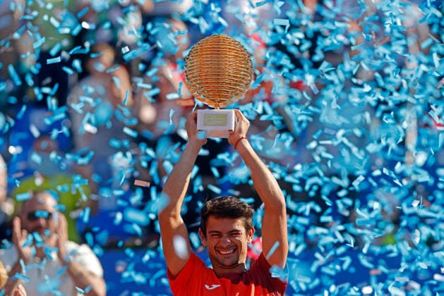 (260406) -- BUCHAREST, April 6, 2026 -- Mariano Navone of Argentina celebrates with the trophy after winning the final match against Daniel Merida of Spain at the ATP, Tennis Herren 250 Tiriac Open tennis tournament in Bucharest, Romania, April 5, 2026. (Photo by Xinhua) (SP)ROMANIA-BUCHAREST-TENNIS-ATP 250 TIRIAC OPEN CristianxCristel 