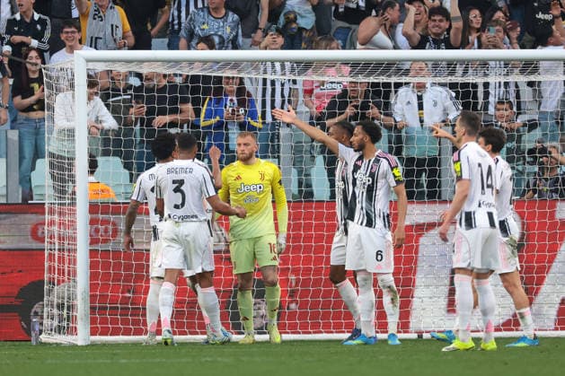 Turin, Italy, 6th April 2026. Michele Di Gregorio of Juventus is mobbed by team mates after saving a penalty and subsequent follow up from Aaron Martin of Genoa CFC during the Juventus vs Genoa Serie A match at Allianz Stadium, Turin. Picture credit should read: Jonathan Moscrop Sportimage EDITORIAL USE ONLY. No use with unauthorised audio, video, data, fixture lists, club league logos or live services. Online in-match use limited to 120 images, no video emulation. No use in betting, games or single club league player publications. SPI_038_JM_JUVE_GENOA SPI-4644-0038