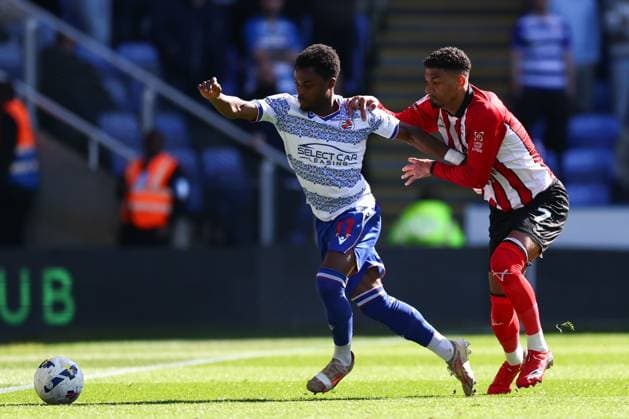 Daniel Kyerewaa of Reading under pressure from Reeco Hackett-Fairchild of Lincoln City Reading v Lincoln City, Sky Bet League One, Football, Select Car Leasing Stadium, Reading, UK - 06 Apr 2026Reading Select Car Leasing Stadium United Kingdom EDITORIAL USE ONLY No use with unauthorised audio, video, data, fixture lists, club league logos or live services. Online in-match use limited to 120 images, no video emulation. No use in betting, games or single club league player publications. Copyright: xSimonxDael Shutterstockx 16811828dk