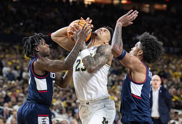 April 6, 2026, Indianapolis, Indiana, USA: Michigans Yaxel Lendeborg fights for possession against UConns Malachi Smith and Jaylin Stewart during first half action of the NCAA, College League, USA Mens Basketball Championship. Michigan went on to win 69-63. Monday, April 7, 2026. Indianapolis USA - ZUMAr44_ 20260406_zsp_r44_015 Copyright: xThomasxJ.xRussox