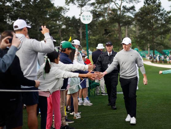 Rory McIlroy of Northern Ireland greets fans while walking to the 8th hole tee box green during a practice round on the Tuesday before The Masters Tournament at Augusta National Golf Club on Tuesday, April 7, 2026 in Augusta, Georgia.  AUG20260407105 JOHNxANGELILLO