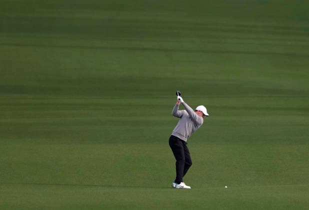 Rory McIlroy of Northern Ireland hits his second shot on the 8th hole during a practice round on the Tuesday before The Masters Tournament at Augusta National Golf Club on Tuesday, April 7, 2026 in Augusta, Georgia.  AUG20260407107 JOHNxANGELILLO
