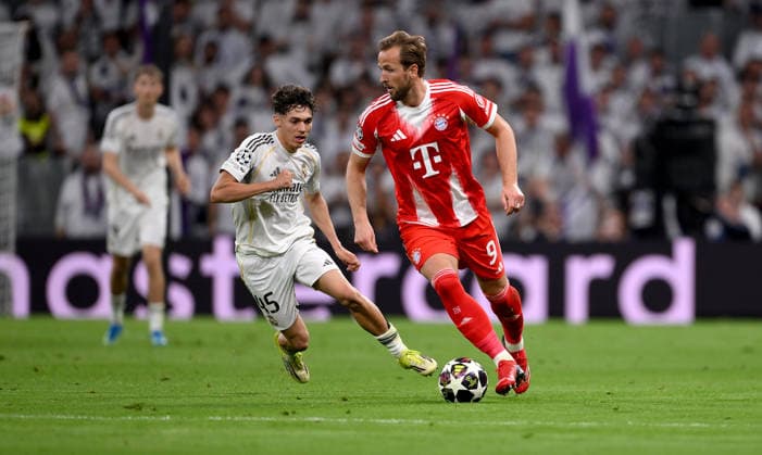 FUSSBALL CHAMPIONS LEAGUE SAISON 2025 2026 Viertelfinal Hinspiel 07.04.2026 Real Madrid - FC Bayern Muenchen Thiago Pitarch (li, Real Madrid) gegen Harry Kane (re, FC Bayern Muenchen)