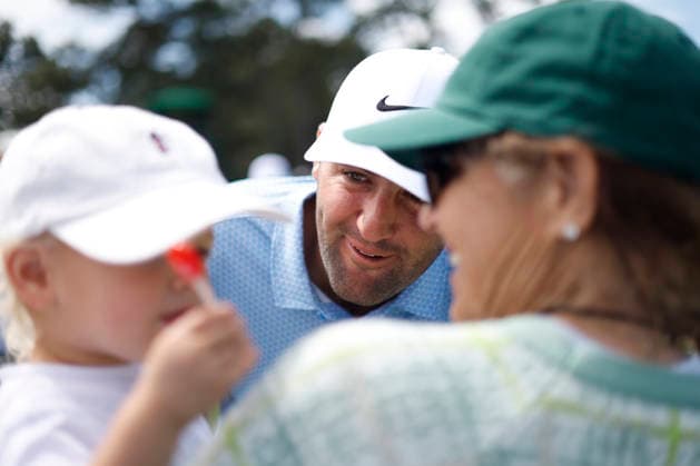 Scottie Scheffler greets his son Bennett on his way to the 8th green during a practice round on the Tuesday before The Masters Tournament at Augusta National Golf Club on Tuesday, April 7, 2026 in Augusta, Georgia.  AUG20260407135 JOHNxANGELILLO