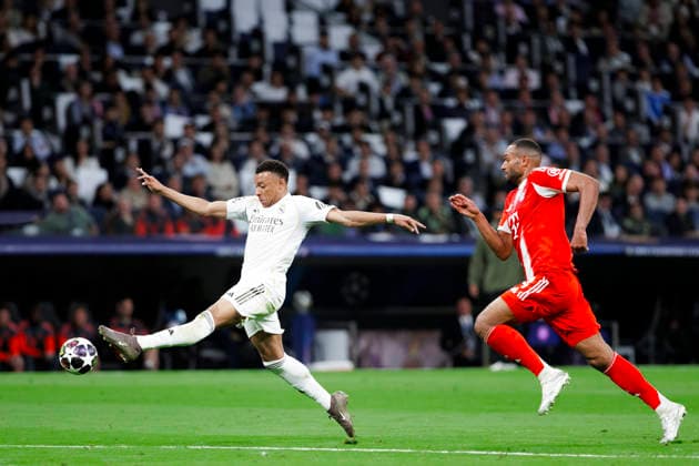 UEFA champions league - Real Madrid vs Bayern Munchen MADRID, SPAIN - April 7:Kylian Mbappe of Real Madrid and Jonathan Tah of Bayern Munich in action during the UEFA champions league 2025 26 Quarter-finals first leg match between Real Madrid and Bayern Munchen at Santiago Bernabeu Stadium. (Photo by Guille Martinez f22photo) Madrid Santiago Bernabeu Stadium Spain Copyright: xGuillermoxMartinezx
