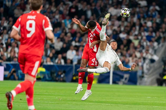 Real Madrid CF s Kylian Mbappe and Bayern Munchen™s Jonathan Tah during Champions League 2025 2026, Quarter-finals, first Leg match. April 7, 2026 (202604071075)
